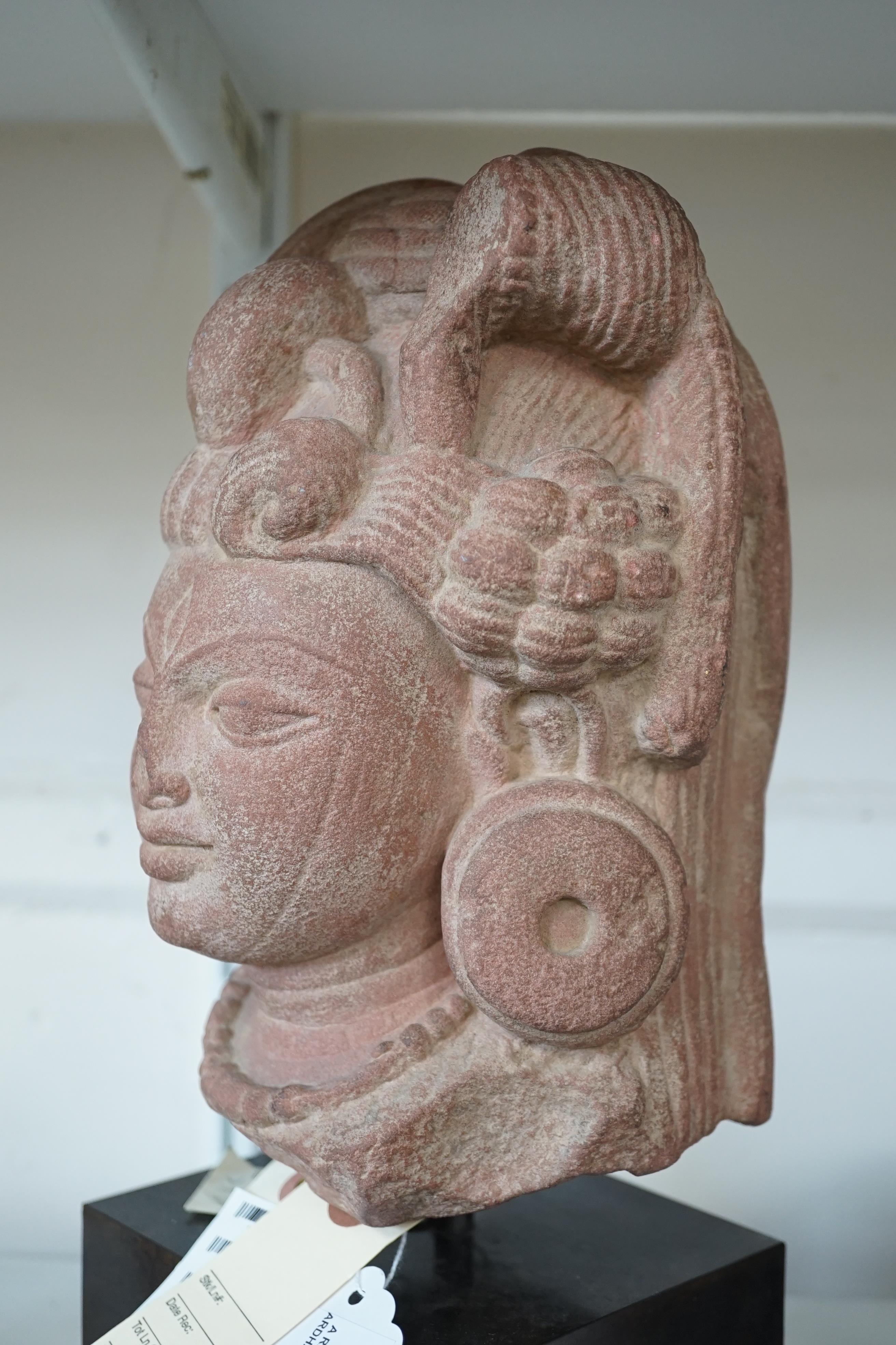 A red stone head of Ardhanarishvara, Muthura region, India, Gupta period, c.5th century A.D.